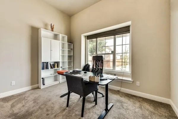 a workspace with furniture and a window