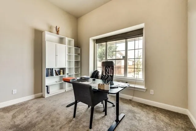 a workspace with furniture and a window
