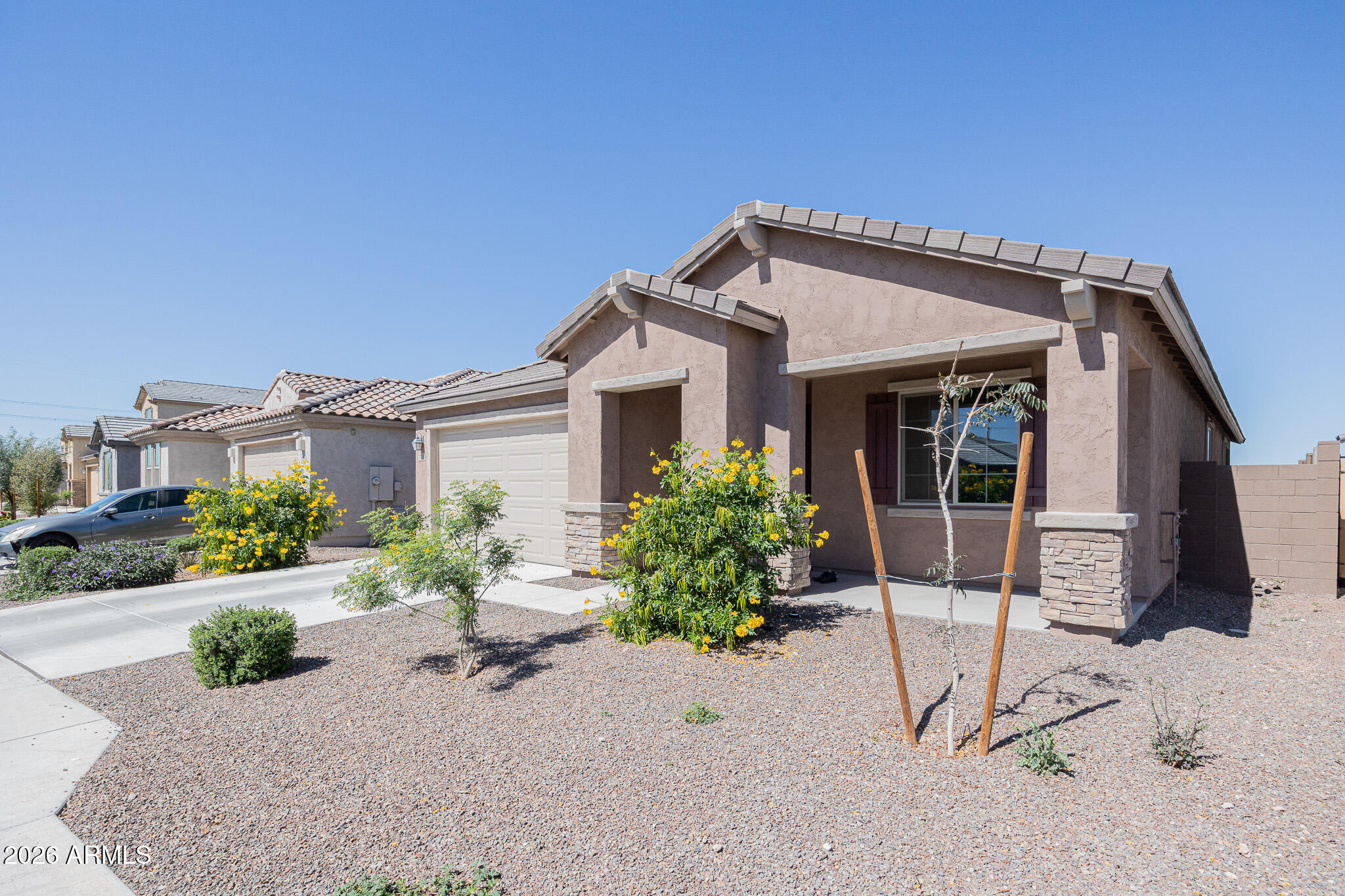 7128 West Coles Road Laveen, AZ 85339 - Photo 3 of 28 a front view of a house with garden
