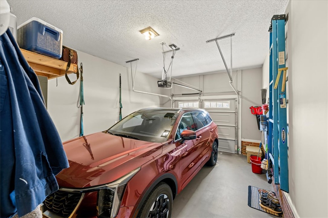 623 New Hope Road Anderson, SC 29626 - Photo 35 of 49 Functional concrete flooring and overhead lighting define this practical vehicle storage area.