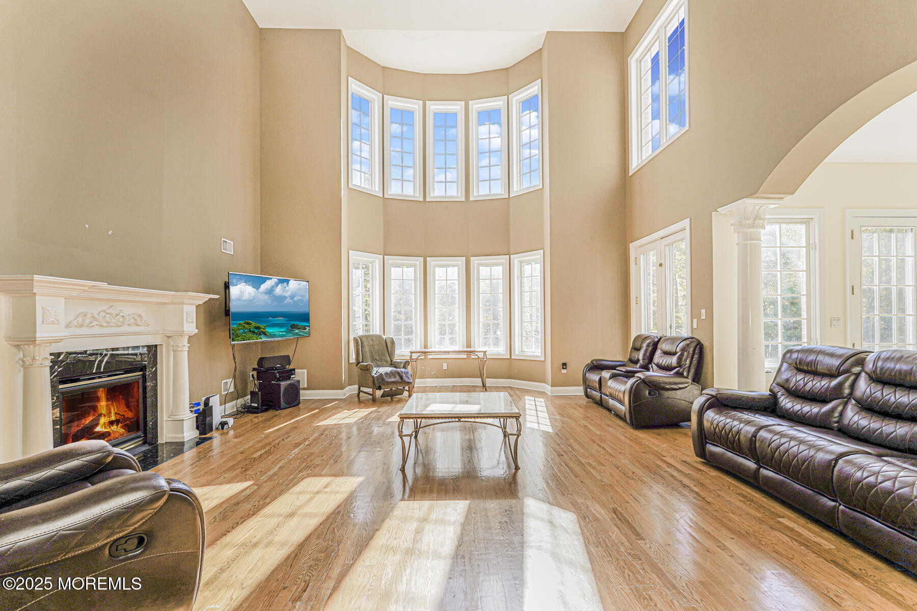 97 Stone Hill Road Colts Neck, NJ 07722 - Photo 11 of 51 a living room with furniture fireplace and a large window