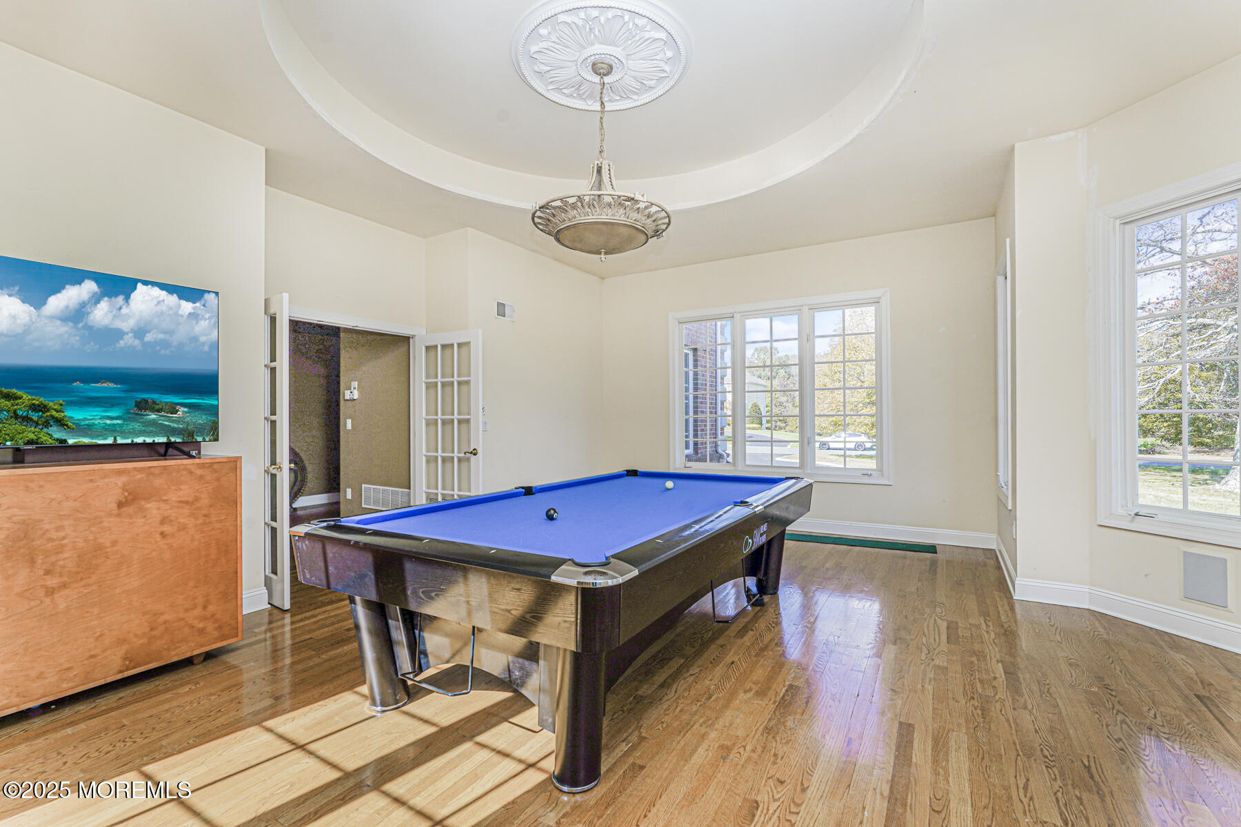 97 Stone Hill Road Colts Neck, NJ 07722 - Photo 16 of 51 a room with pool table windows and wooden floor