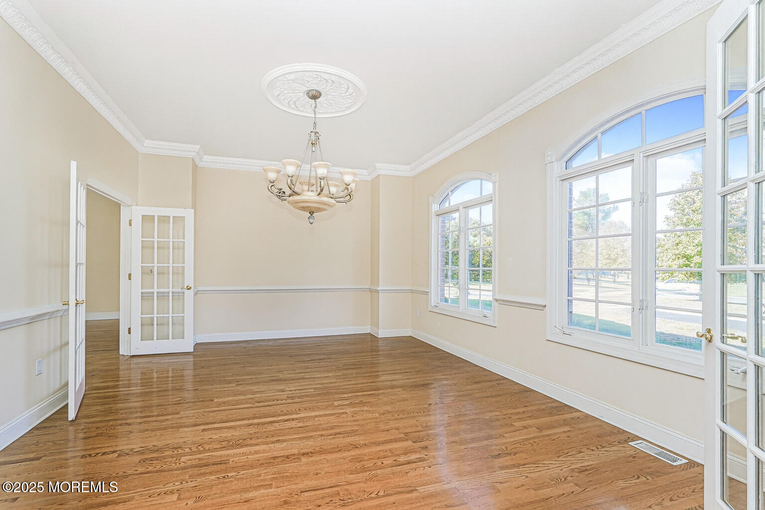 97 Stone Hill Road Colts Neck, NJ 07722 - Photo 17 of 51 wooden floor in an empty room with a window