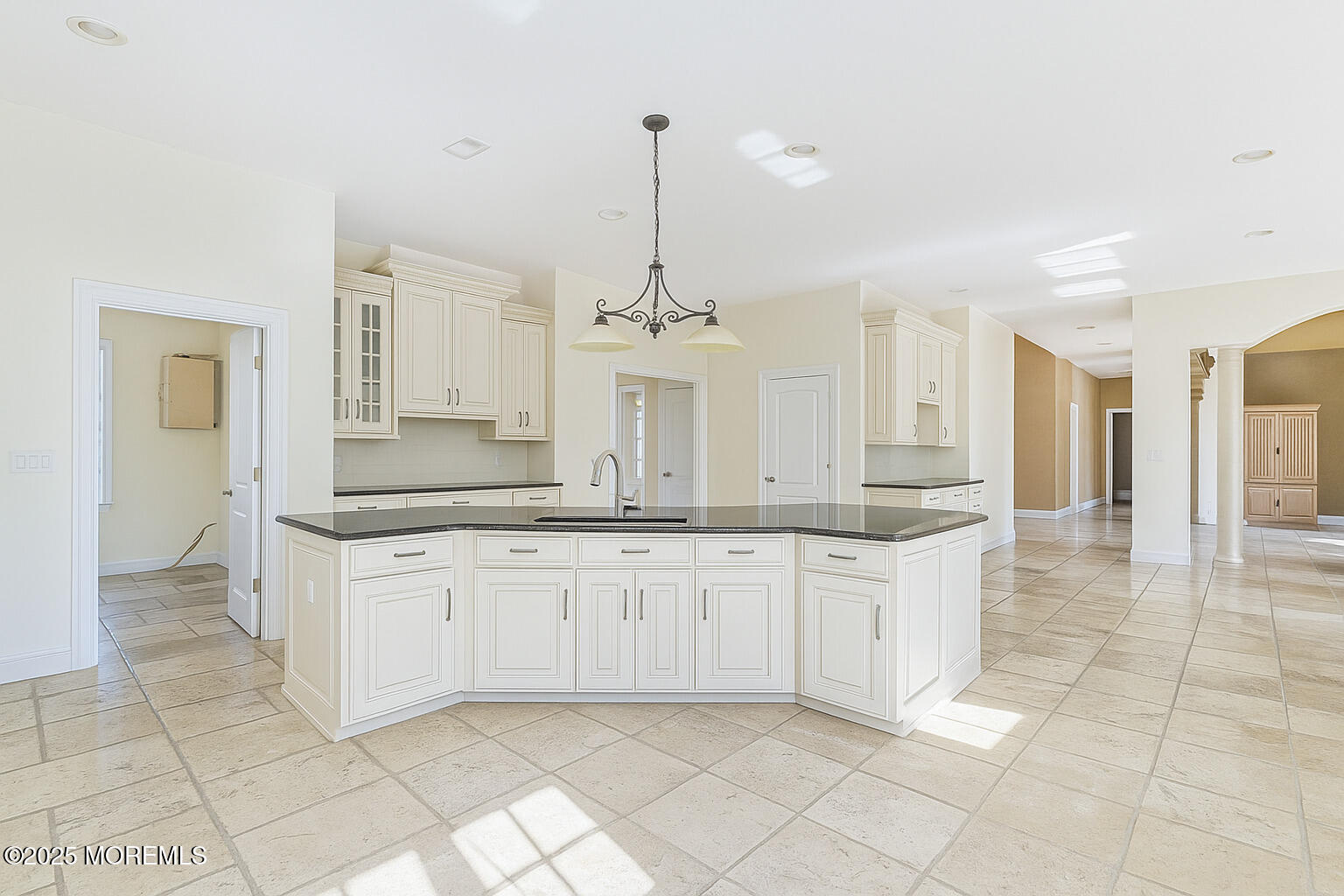 97 Stone Hill Road Colts Neck, NJ 07722 - Photo 27 of 51 a large kitchen with granite countertop white cabinets and a sink