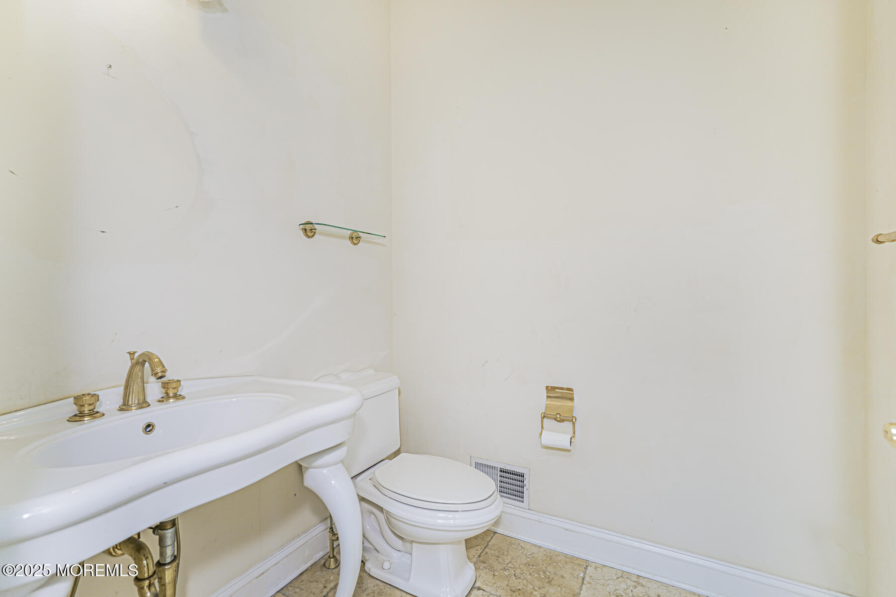 97 Stone Hill Road Colts Neck, NJ 07722 - Photo 28 of 51 a bathroom with a sink a toilet and mirror
