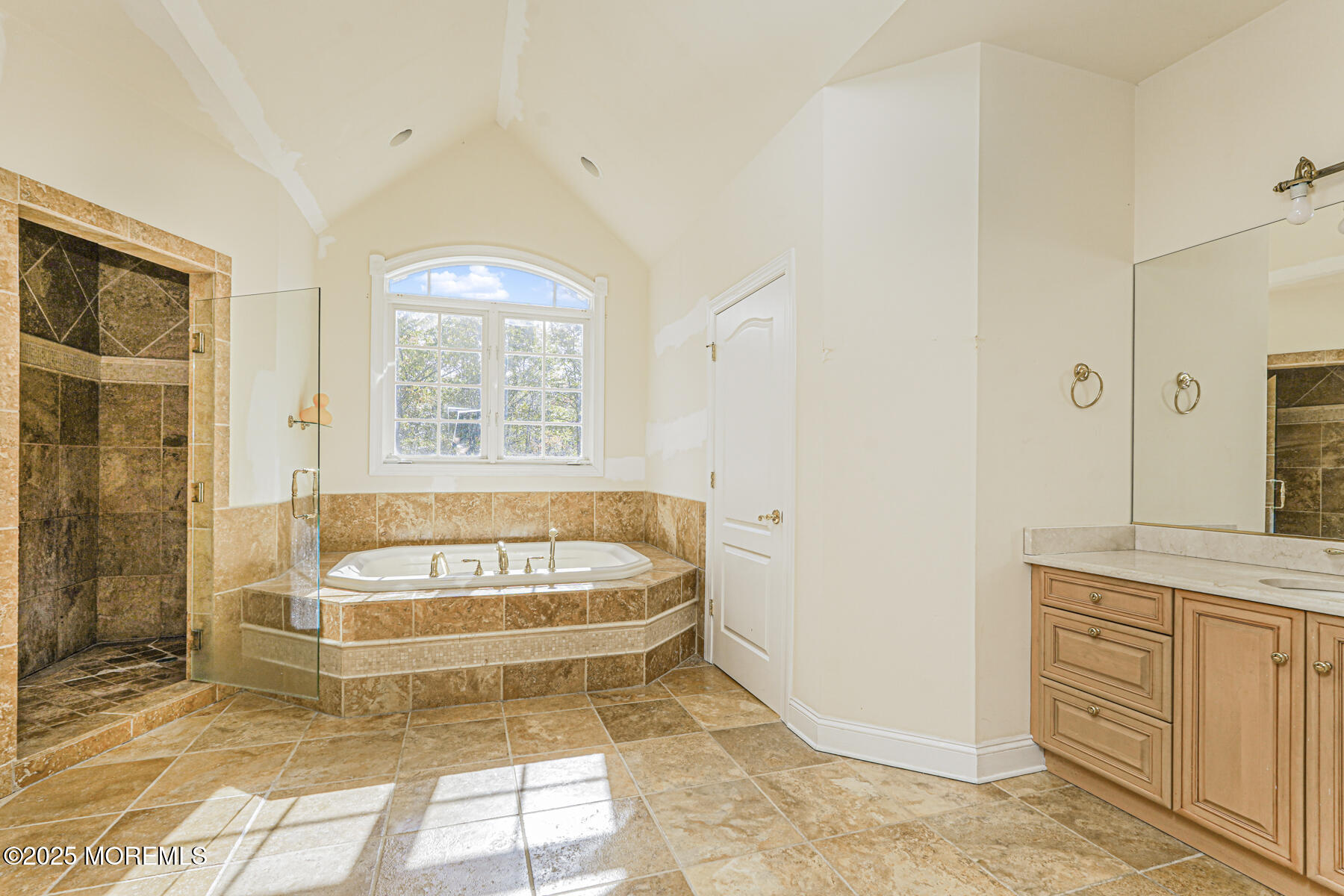 97 Stone Hill Road Colts Neck, NJ 07722 - Photo 31 of 51 a spacious bathroom with a tub a window and a shower