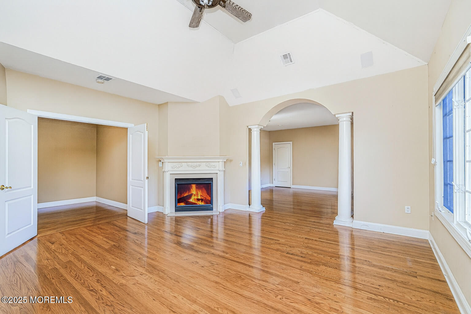 97 Stone Hill Road Colts Neck, NJ 07722 - Photo 32 of 51 a view of livingroom with hardwood floor and a fireplace