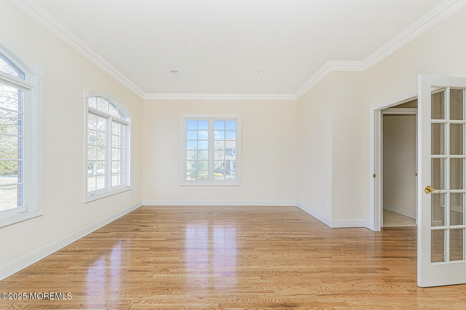 97 Stone Hill Road Colts Neck, NJ 07722 - Photo 35 of 51 a view of an empty room with wooden floor and a window