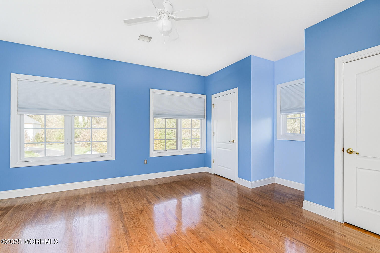 97 Stone Hill Road Colts Neck, NJ 07722 - Photo 40 of 51 a view of an empty room with wooden floor and a window