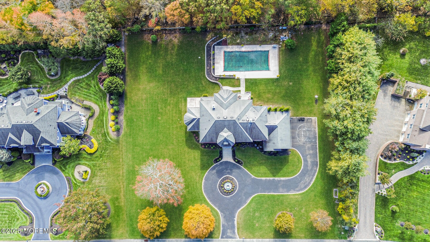 97 Stone Hill Road Colts Neck, NJ 07722 - Photo 4 of 51 aerial view of a swimming pool with outdoor seating