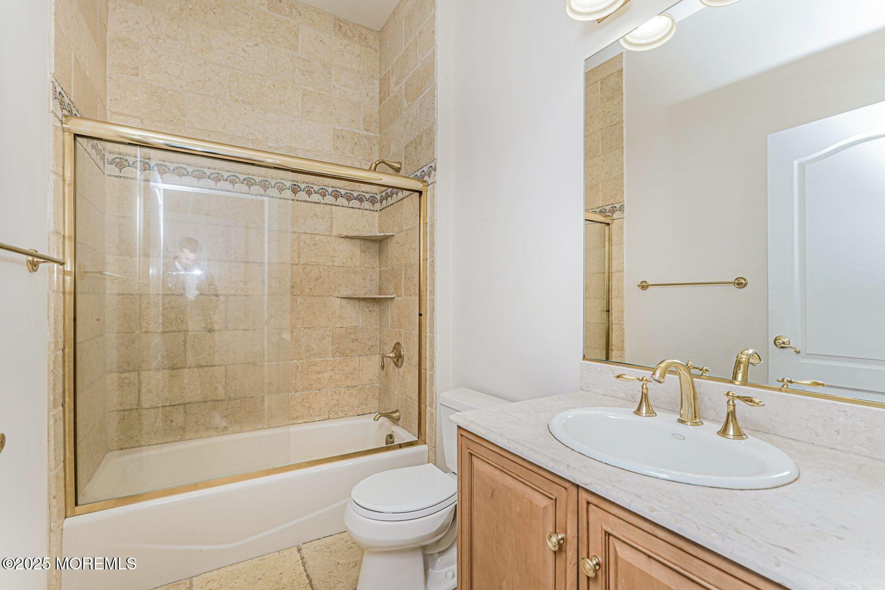 97 Stone Hill Road Colts Neck, NJ 07722 - Photo 42 of 51 a bathroom with a sink a toilet and shower