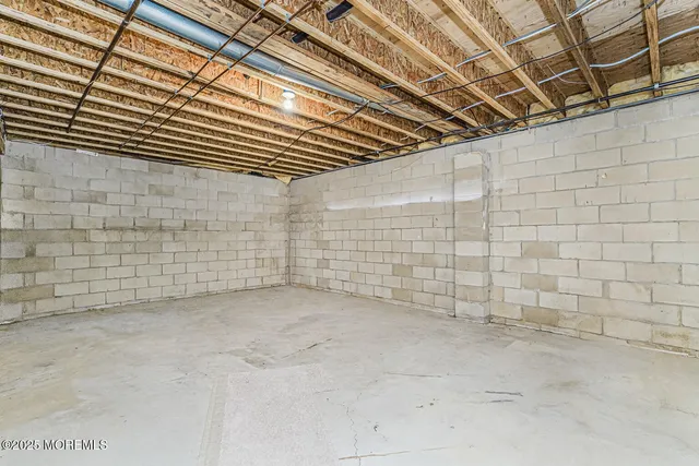 a view of a hallway with a sink and a refrigerator