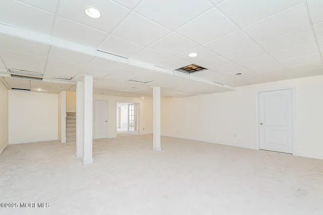 a view of an empty room with a ceiling fan