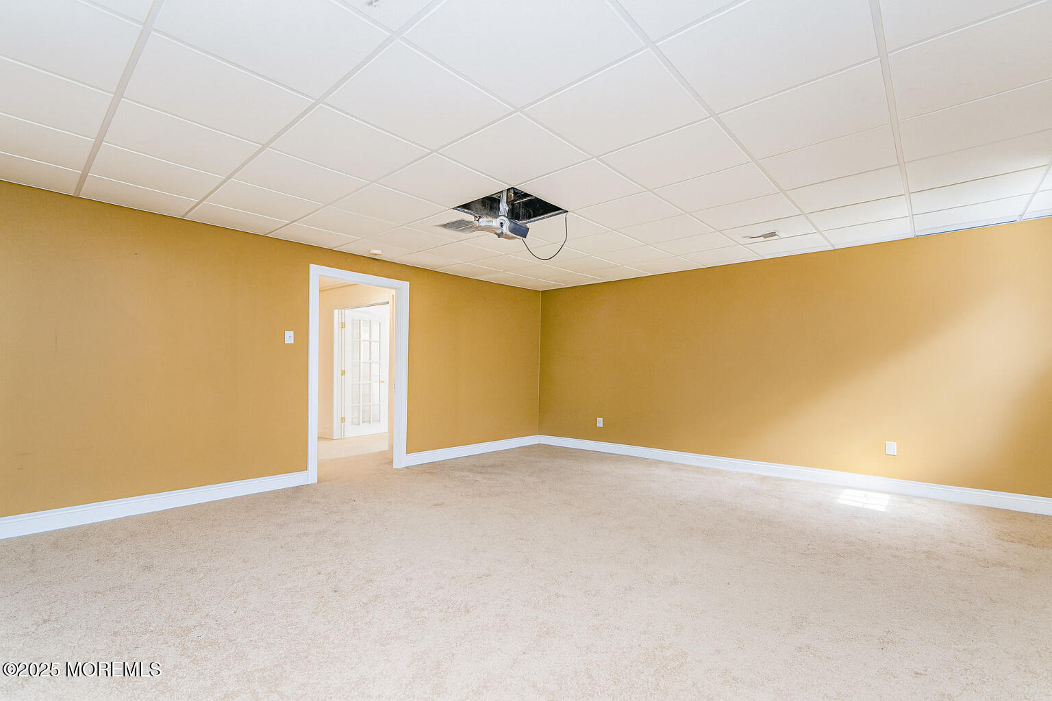 97 Stone Hill Road Colts Neck, NJ 07722 - Photo 48 of 51 a view of an empty room with a ceiling fan