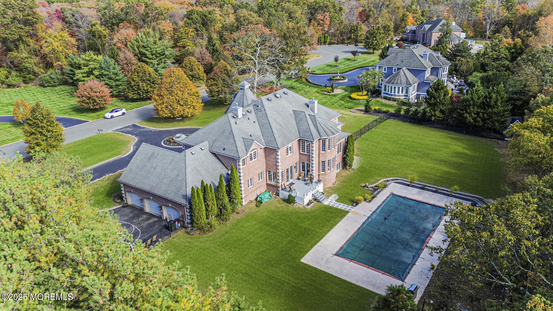 97 Stone Hill Road Colts Neck, NJ 07722 - Photo 5 of 51 an aerial view of a house with garden space sitting space and swimming pool