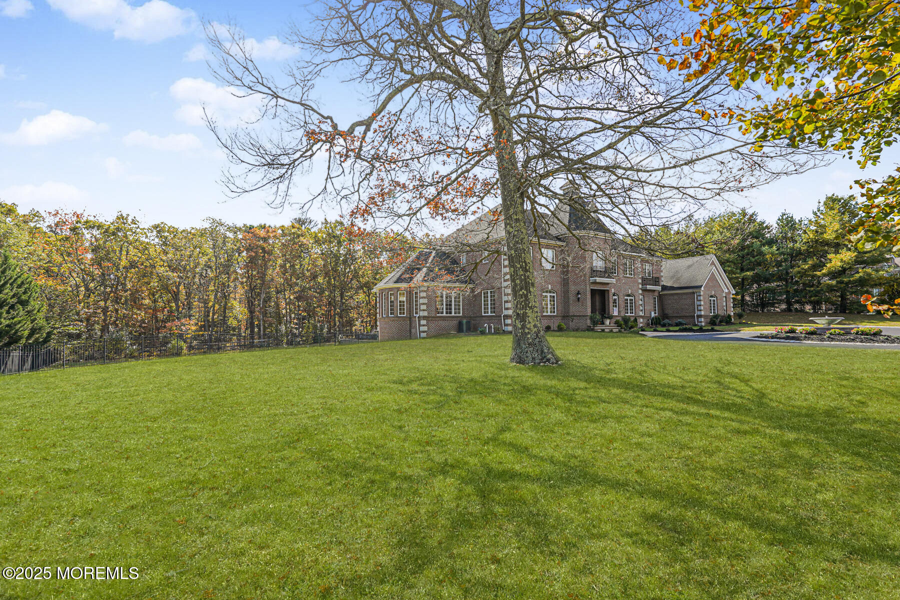97 Stone Hill Road Colts Neck, NJ 07722 - Photo 7 of 51 a view of a house with a yard