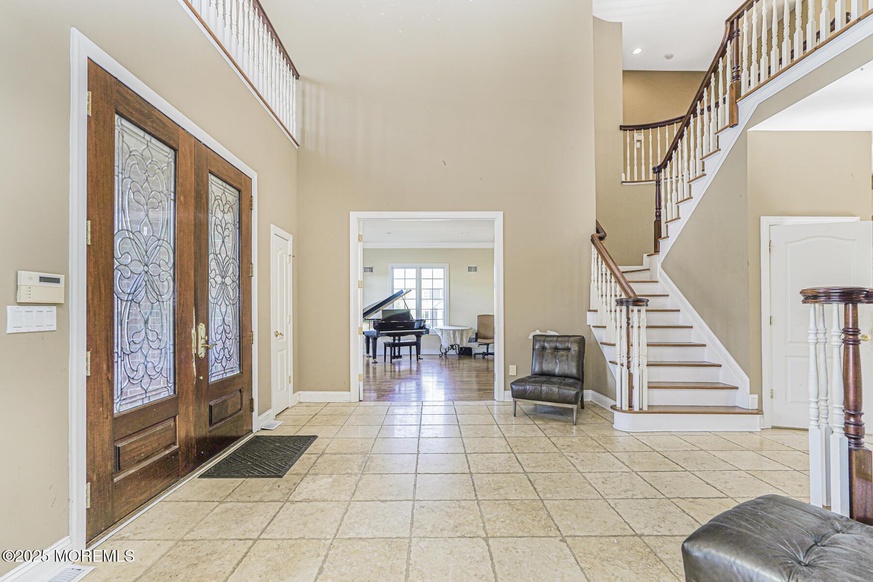 97 Stone Hill Road Colts Neck, NJ 07722 - Photo 9 of 51 a living room with furniture and a floor to ceiling window