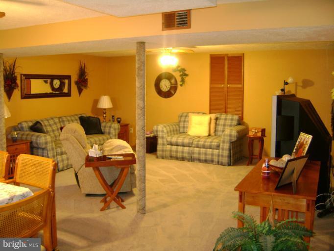 2215 Wilhelm Avenue Rosedale, MD 21237 - Photo 2 of 12 a living room with furniture and a flat screen tv