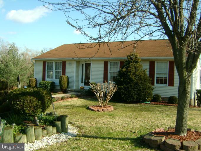 2215 Wilhelm Avenue Rosedale, MD 21237 - Photo 12 of 12 a front view of a house with garden