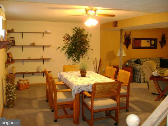 2215 Wilhelm Avenue Rosedale, MD 21237 - Photo 6 of 12 a view of a balcony with table and chairs