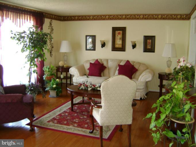 2215 Wilhelm Avenue Rosedale, MD 21237 - Photo 7 of 12 a living room with furniture and a potted plant