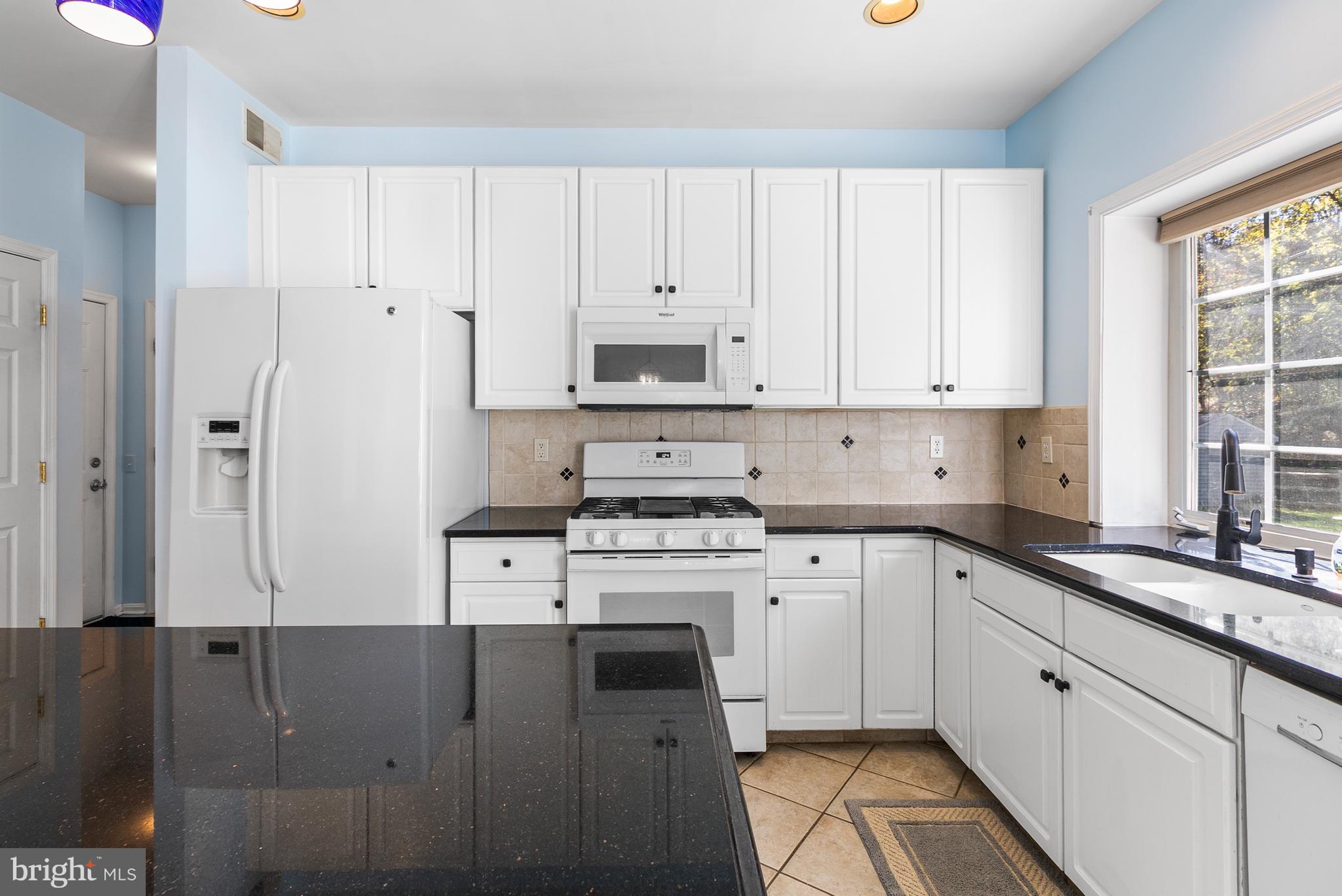 8 Peacock Place Newark, DE 19711 - Photo 20 of 70 a kitchen with cabinets appliances and a window
