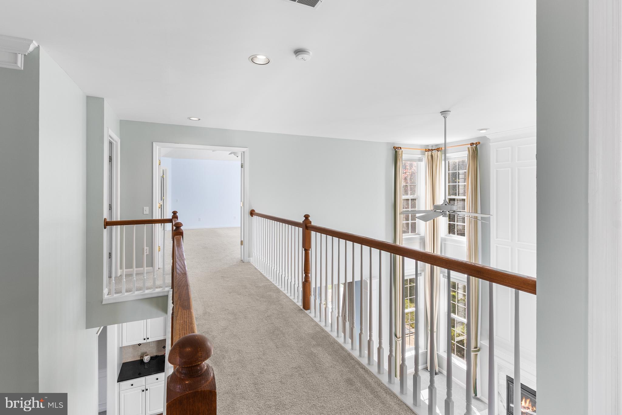 8 Peacock Place Newark, DE 19711 - Photo 38 of 70 a view of a hallway with wooden floor and staircase