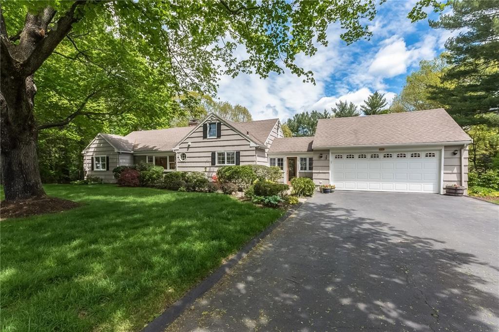 30 Stonybrook Road Norwalk, CT 06851 - Photo 1 of 1 a front view of a house with yard and green space