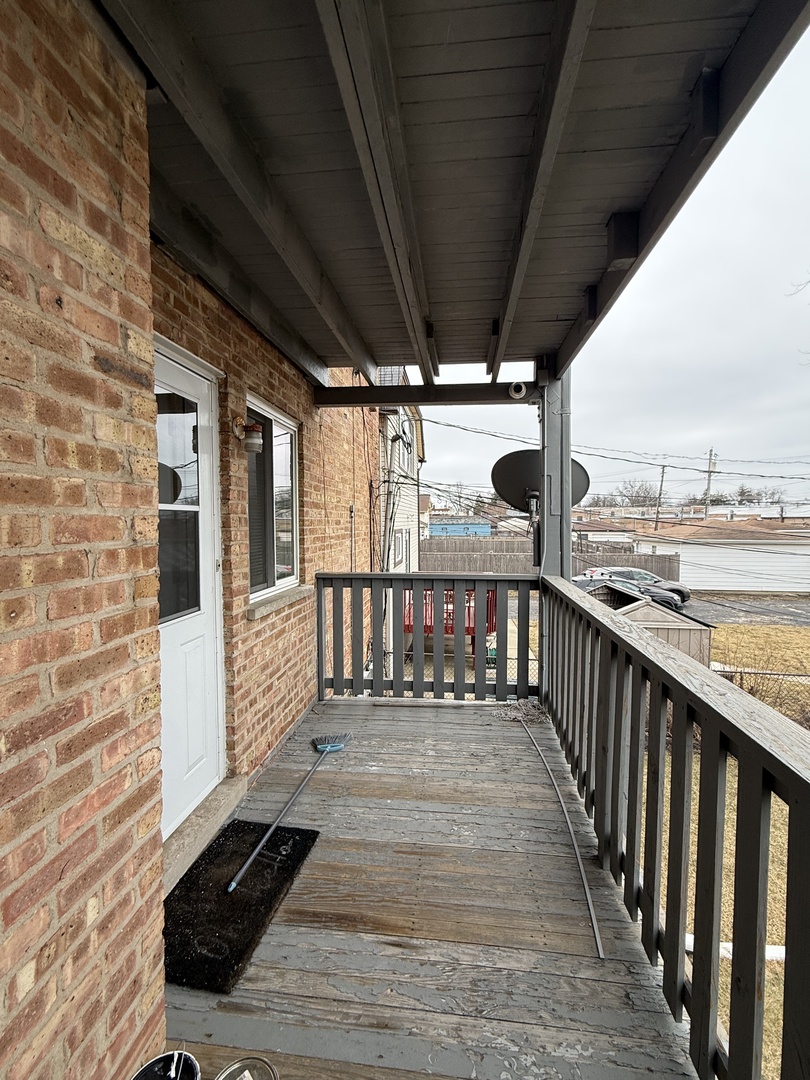 2124 14th Avenue, Unit 1S Broadview, IL 60155 - Photo 7 of 7 a view of a balcony with wooden floor
