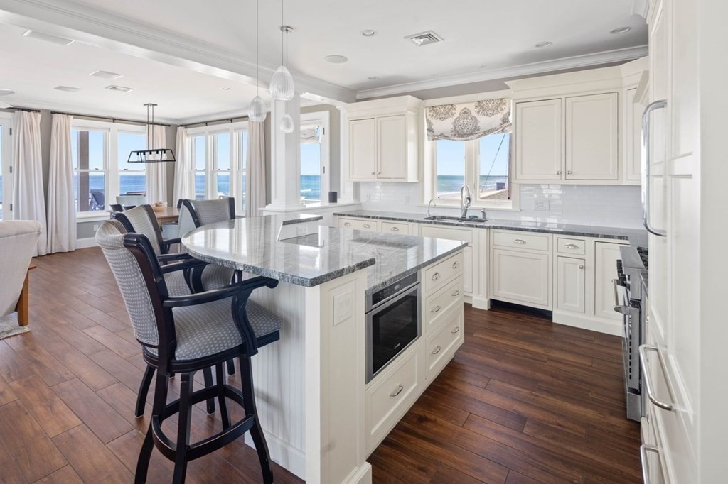12 Monitor Road Marshfield, MA 02050 - Photo 12 of 38 a kitchen with sink cabinets and wooden floor