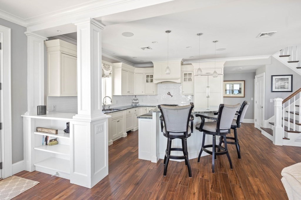 12 Monitor Road Marshfield, MA 02050 - Photo 14 of 38 a view of a dining room with furniture and wooden floor