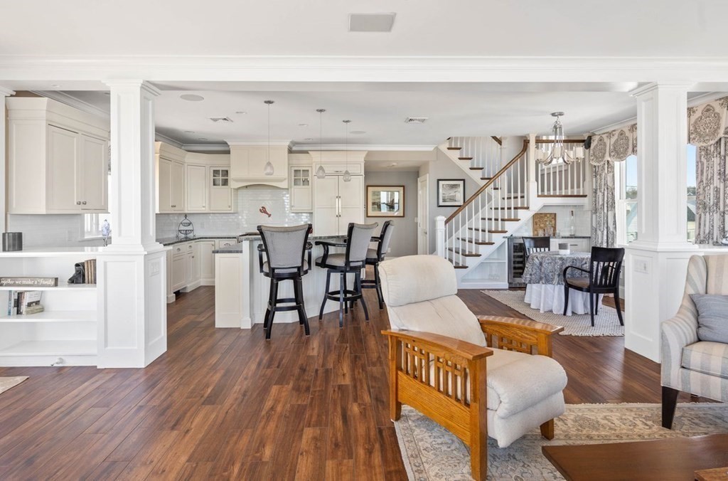 12 Monitor Road Marshfield, MA 02050 - Photo 16 of 38 a living room with furniture wooden floor and a kitchen view