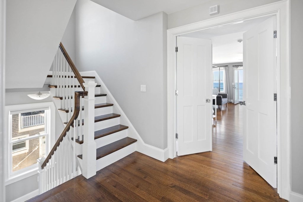 12 Monitor Road Marshfield, MA 02050 - Photo 19 of 38 a view of a hallway with wooden floor and entryway
