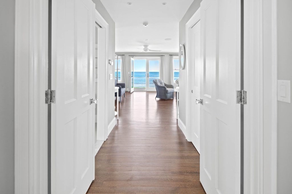 12 Monitor Road Marshfield, MA 02050 - Photo 20 of 38 a view of a hallway with wooden floor windows and a livingroom view
