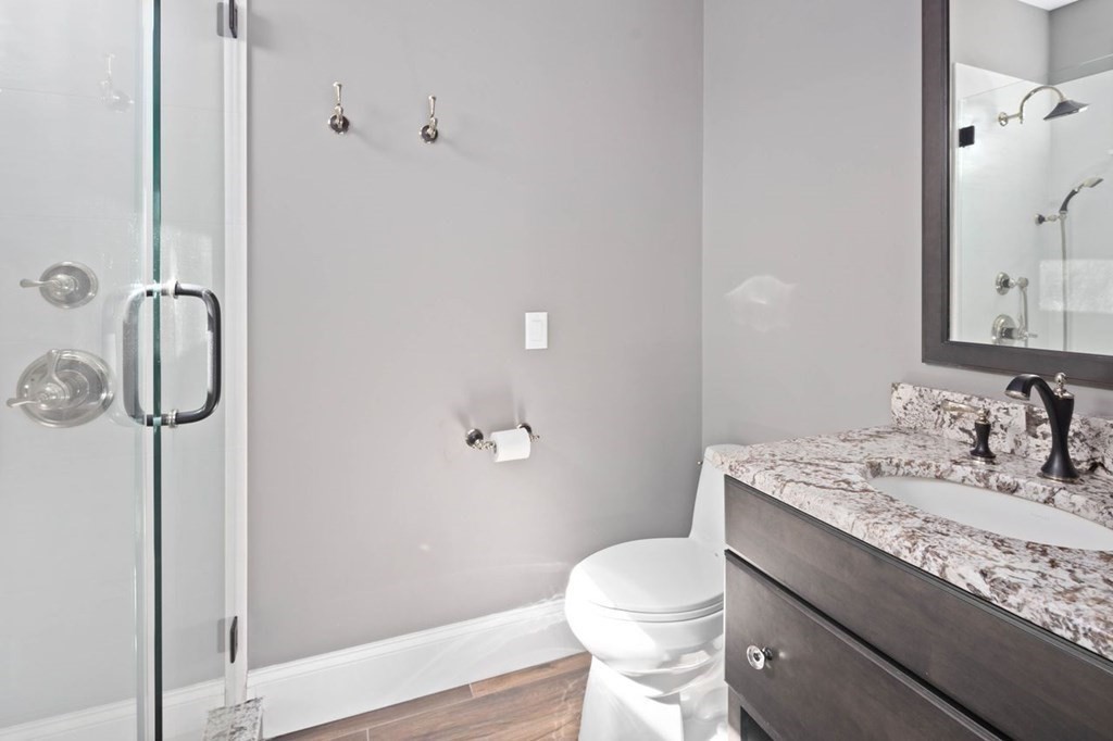 12 Monitor Road Marshfield, MA 02050 - Photo 25 of 38 a bathroom with a granite countertop sink toilet and shower