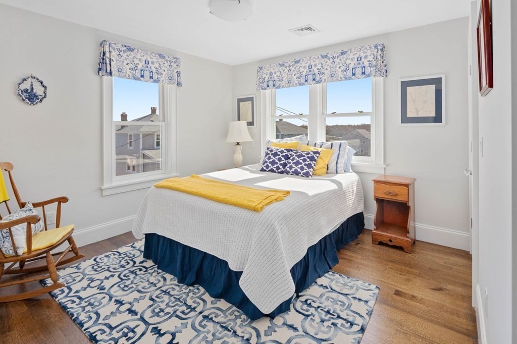 12 Monitor Road Marshfield, MA 02050 - Photo 26 of 38 a bedroom with a bed and a table in it