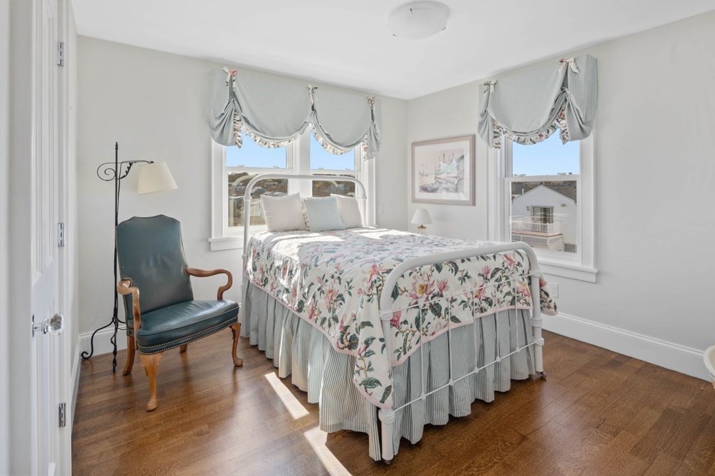 12 Monitor Road Marshfield, MA 02050 - Photo 27 of 38 a bedroom with a bed and a chair with the wooden floor