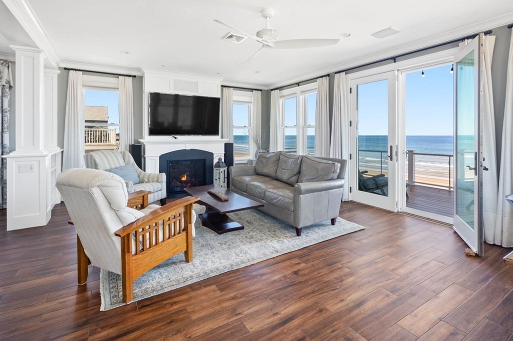 12 Monitor Road Marshfield, MA 02050 - Photo 6 of 38 a living room with furniture a flat screen tv and a fireplace