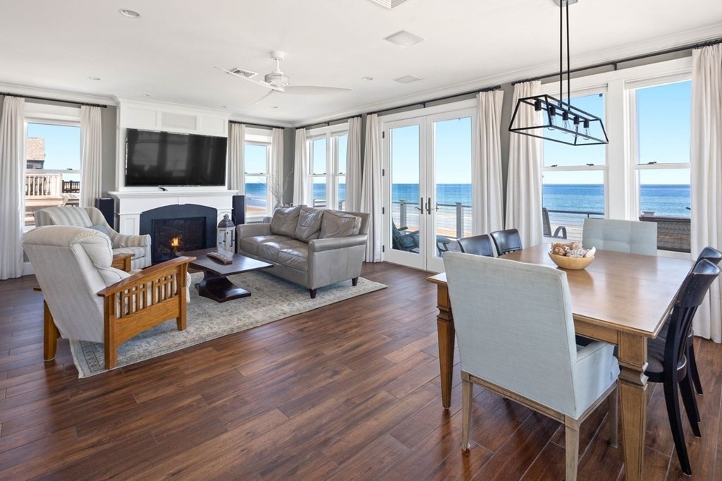 12 Monitor Road Marshfield, MA 02050 - Photo 9 of 38 a living room with furniture a fireplace and a flat screen tv