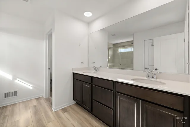 a bedroom with a large bed and a large window