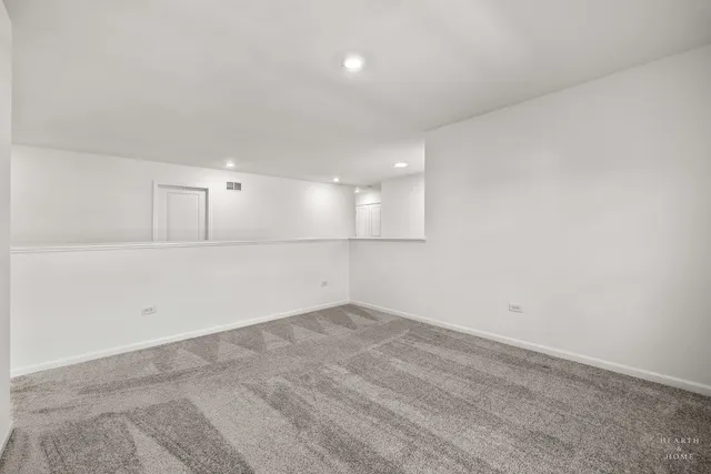 a bed room with a bed and a large window