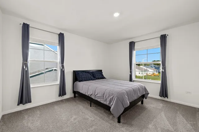 a bathroom with a sink a toilet a shower and a mirror