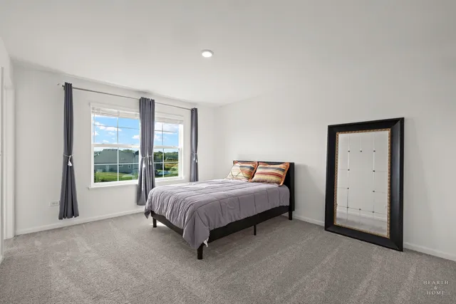 a view of a small space with wooden floor and a window