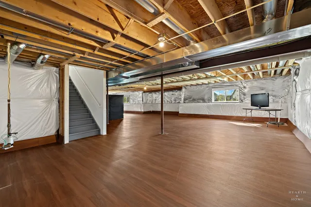 a view of a room with wooden floor