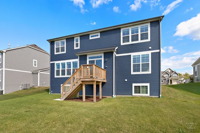 a sign that is sitting on a brick wall in front of a building