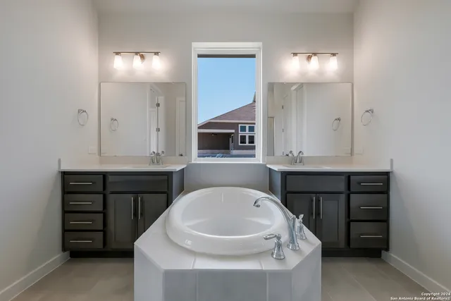 a bathroom with a bathtub and a sink
