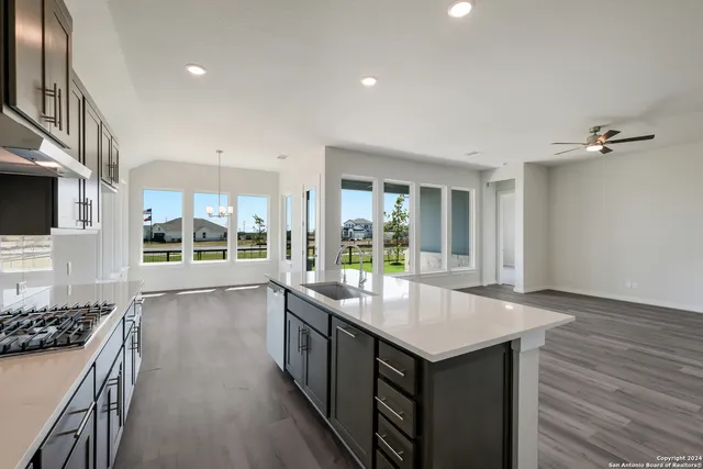 a kitchen with a stove and a sink