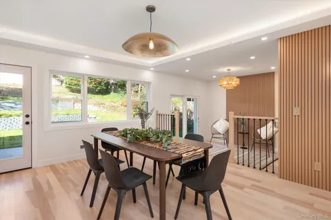 a view of a dining room with furniture window and wooden floor