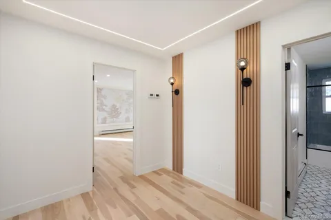 a view of a bathroom from a hallway