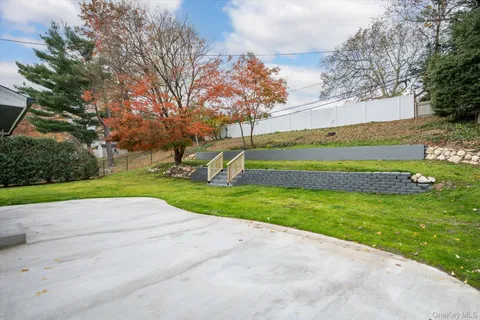 a view of a park with large trees